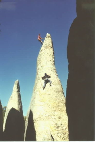 Chad Berger on the crux moves of Cerberus. John Wachter Belaying. Photo by Nathan Kutcher. Taken Sept 2001