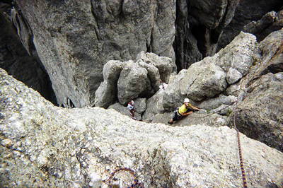 Angela climbing the crack on pitch two.