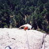 Looking down from the belay.  The climber is just above the 3rd bolt.