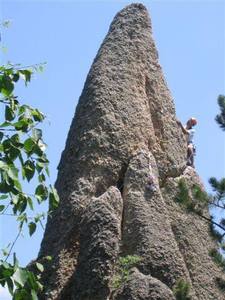 Run it out to the solid anchors; after good gear in the horizontal seam.