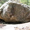 The "Loosening the Lid" Boulder is located to the South of Mt. Baldy and Half Dome, to the East of the "Lillipad" Boulder and uphill and to the West of the "Hueco Wall."