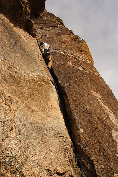 Working the crack in the first pitch of Crab Corner, below the roof.