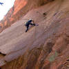 Mark Limage making the transition from the flake to the crack during an ascent in 2001.