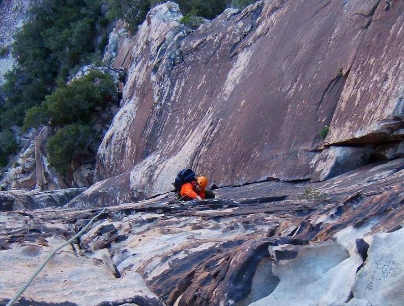 Looking down the P2 finger crack of Bourbon Street.  The slanting corner on Frogland's second pitch is the crack beneath the climber.