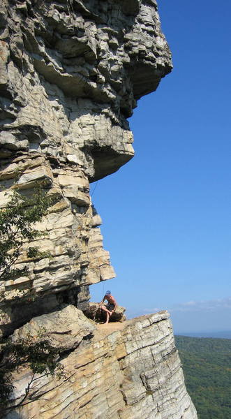 Climber preparing to start the exposed and exciting last pitch of High Exposure, one of the best 5.6 pitches on the planet.