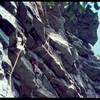 My brother Paul at the rest before the crux. We're climbing on a 300' piece of 9mm rope, folded in half, that he got off a spool somewhere. What a deal.