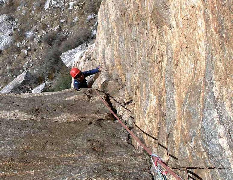 Manny following Mike on pitch 2.  The dihedral had some dirt and loose stone, Mike bypassed it and I cleaned it.  This rock is banded gneiss, reminds me of Lover's Leap with the dark bands forming horizontal dikes.   