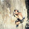 A pre-gray JB attacking the crux in 1995.  Photo by Bob Harrington.  Bob said it looked like tidal waves were rolling through my back.