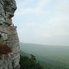 Same climber, reaching the High E ledge.