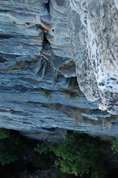 Looking down on the first crux roof.  An exploratory hand emerges...