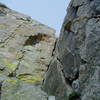 Looking up the dihedral and crack system at the beginning of p.1. After ascending the snow gully at the base, climb up and right on 3rd class loose rock and then traverse right to get the start of p.1.  We climbed the crack (5.7) on the right face of the dihedral.