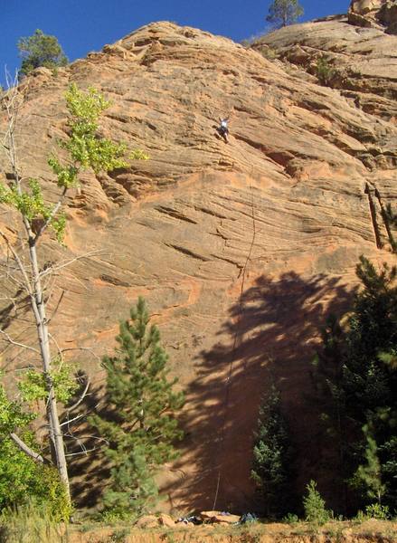 Climbing on the south end of the East Wall. October 2005. Justin Rogers on lead. I believe it is rated 5.10.