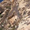 Over the roof, Karsten starts up the thin face crack.