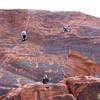 Climbers on Neon Sunset (left) and Technicolor Sunrise (right).  Zipperhead starts on the thin crack between these routes.