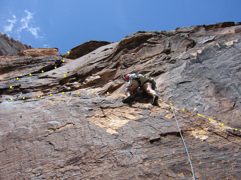 Sharon Vinick on the fun ramp at the start of P3.  The crux traverse left past a bolt lies above, followed by a steep, airy corner.