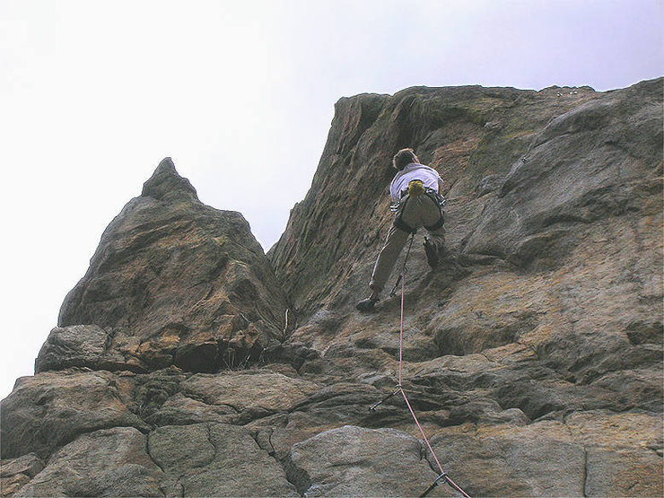 Halfway through the crux...Mico Alejandro dodges the loose holds marked with X's, on his way to a brillant onsight.