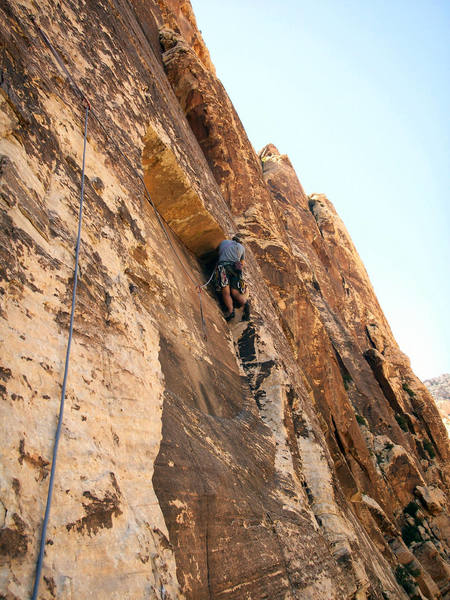 Andrew about to step out over the massive roof on 2nd pitch. (Cannot be seen in photo)