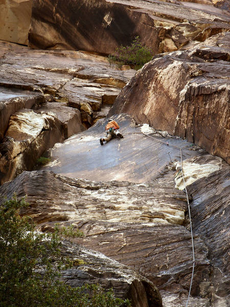 Georg climbs through the .10a first pitch crux