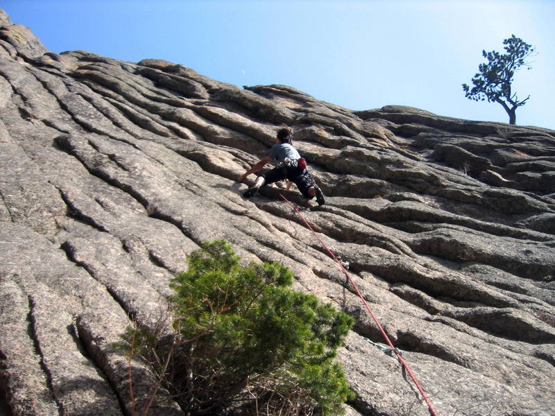 Approaching the mid-height crux, still in the 5.10 section.