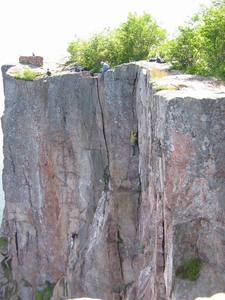 The climber in green is on Bluebells, the climber in purple is on Phantom Crack.