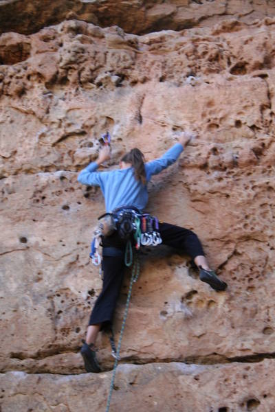Sheri leading the fun juggy route and getting ready to clip the second bolt.