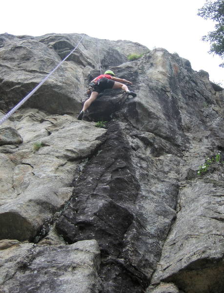 Jean Aschenbrenner cranking the crux roof on Shiny Toys.