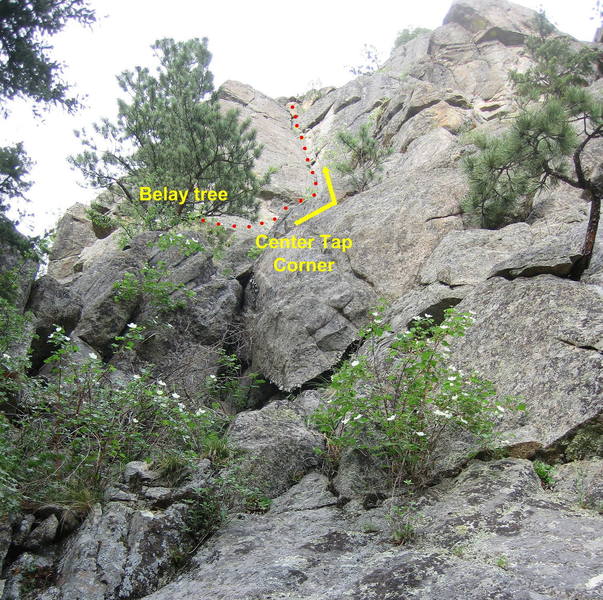 Center Tap Corner. Scramble up to a big tree to belay.  Climb easy terrain the corner, then up the corner to the top.
