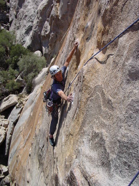 Ivan starting the crux traverse to the P1 anchors.  Hands and feet get thinner as you move across.