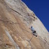 Glad to get to larger holds, Paul looks back at 1st crux.  Many more to go!