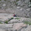 Deb Thompson, on the start of P1, zoomed in. She is probably at the crux of the climb.