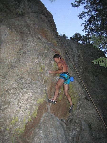 The crux move on Bull Fight (12b) at Mine Hole Crag, in Boulder Canyon, CO.<br>
Image by Brian Freund.