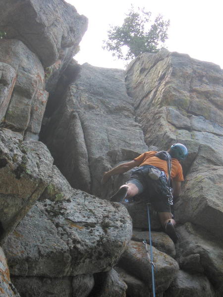 Ron Olsen contemplating the wide crack section on Thus Us. <br>
<br>
Photo by Bruce Hildenbrand.