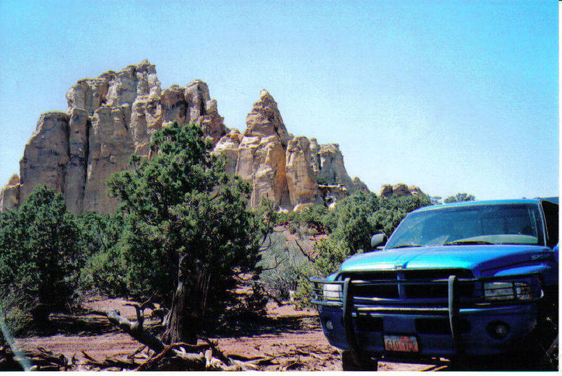 Photo from camping area with "Hide Out Tower" on the right and the South side  of Train Robbers Mesa up to the left.