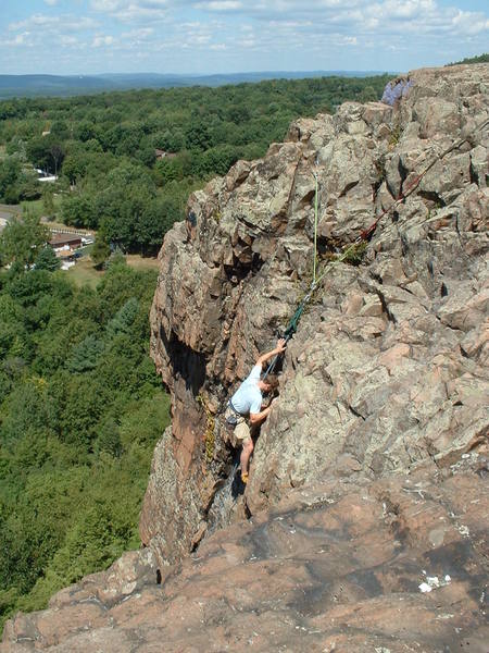 MG high above suburbia on Tiptoe (5.9-), Pinnacle Rock, CT