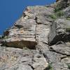 Looking up at the climb from the base.  The wide crack of the first pitch is clearly visible.