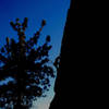 Climber silhouetted on Brian's Song (5.10c), Keller Peak.