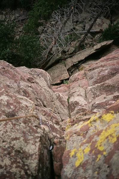 Looking down from the top of 'Curse of the Pharaoh' while on lead. Route is on the South Face of The Sphinx in the Flatirons.