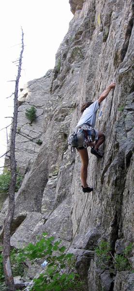 Unnamed climber sails through the opening moves. He is reaching what becomes a solid lieback.