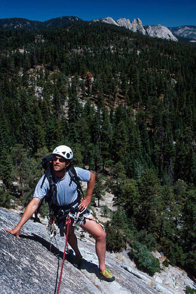 Matt Grieger nears the anchor atop pitch 3 of "Tree Route" as the Needles loom in the distance.