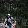 Matt Grieger nears the anchor atop pitch 3 of "Tree Route" as the Needles loom in the distance.