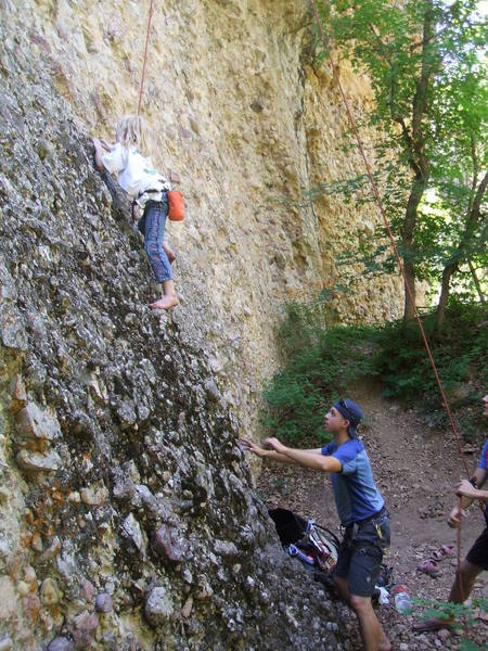 sierra's first climb on rock... yes she's going barefoot