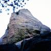 A rope hangs down the face of the Rotert/Fowler route after simul-rapping the Tricotti Nail.