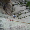 Chuck turning the roof on P1 after the 5.8 traverse.<br>
Photo by Luke Clarke.