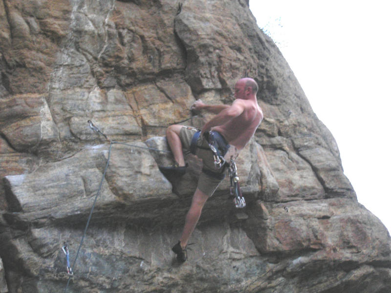 Clipping the bolt after the crux.