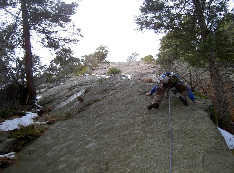 My brother Danny starting the first pitch runout on Seal Rock.  Note the rivulets of water melting off.  Hats off, Danny, to a bold lead!