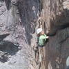 Sarah Fritz digging deep at the end of the crux pitch.