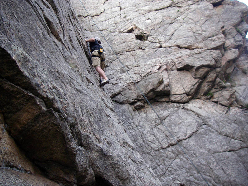 Danny moving up just right of the rope on Surprising Slab.