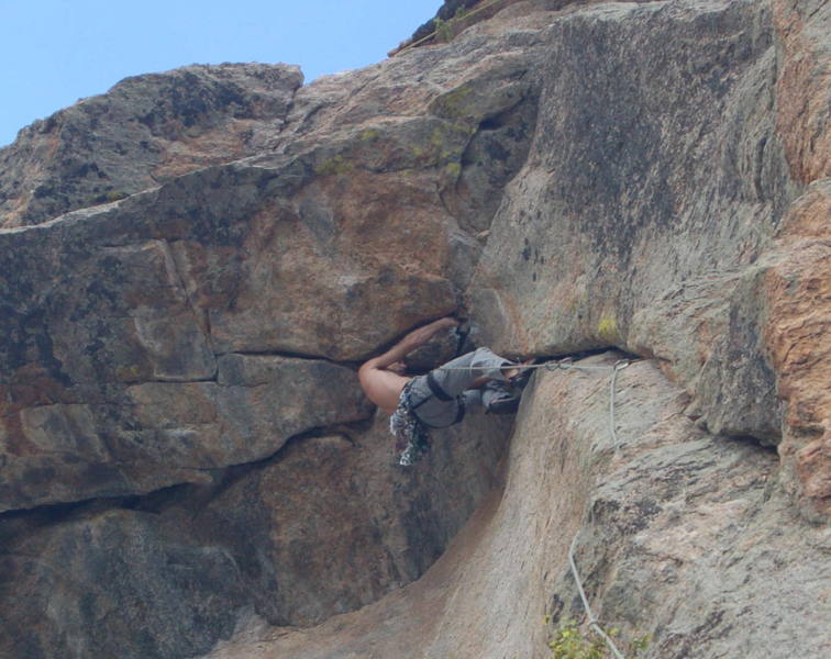 Tony setting gear before starting into the crux sequence of Marlin Alley (11b) on Batman Rock at Lumpy Ridge. Image by Todd Miller