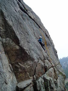 A few moves up after the traverse across the ledge and blocks. I've unclipped from Luke's first piece of gear, the big ring bolt by the end of the pipe, and so the rope is not following the initial part of the climb.