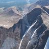 The Trough is the continuous snow ribbon running from the bottom of the picture up into the shadows of the NW face.  The narrows and homestretch are around the corner from the snow at the top of the sunlit broad shoulder in the right half of the picture.